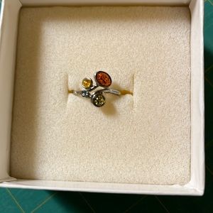 Premier Designs “Priority “ ring with rust, gold and tan stones. Size 7